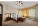 Bedroom featuring a ceiling fan, natural light, and comfortable carpet at 4943 Cains Wren Trl, Sanford, FL 32771