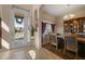 Inviting dining area with tile floors, a chandelier, a china cabinet, and views of the front yard at 4943 Cains Wren Trl, Sanford, FL 32771