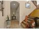 Hallway with staircase access, neutral walls, and tile floors at 4943 Cains Wren Trl, Sanford, FL 32771
