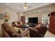 Spacious living room with comfortable leather seating and natural light at 4943 Cains Wren Trl, Sanford, FL 32771