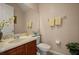 Well-lit powder room featuring a vanity with a marble countertop and decorative accents at 4943 Cains Wren Trl, Sanford, FL 32771