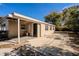 Back patio and exterior of home featuring a door and large windows at 5112 Londonderry Blvd, Orlando, FL 32808