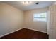 Cozy bedroom with hardwood floors and natural light, offering a tranquil retreat at 5112 Londonderry Blvd, Orlando, FL 32808