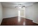 Bright living room with hardwood floors, ceiling fan, and neutral wall colors at 5112 Londonderry Blvd, Orlando, FL 32808