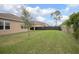 Spacious backyard with lush green grass and a privacy fence at 523 Lazio Cir, Debary, FL 32713