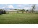 Expansive backyard with lush green grass and a secure privacy fence at 523 Lazio Cir, Debary, FL 32713