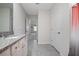Bathroom featuring a granite countertop, neutral paint, and tiled floors at 523 Lazio Cir, Debary, FL 32713