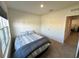 Guest bedroom with window and carpeted floor at 523 Lazio Cir, Debary, FL 32713