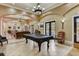 Community room with pool table and comfortable seating at 523 Lazio Cir, Debary, FL 32713