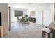Elegant dining area with a round table, stylish chairs, and a modern sideboard with artwork at 523 Lazio Cir, Debary, FL 32713