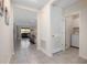 Hallway with entry to the laundry room and a view of the living room at 523 Lazio Cir, Debary, FL 32713