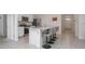 Contemporary kitchen featuring a large island with granite countertops, modern appliances, and tile flooring at 523 Lazio Cir, Debary, FL 32713