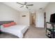 Serene main bedroom featuring a ceiling fan, neutral color palette, and carpet flooring at 523 Lazio Cir, Debary, FL 32713