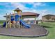 Covered playground with slides and play structures near picnic tables at 523 Lazio Cir, Debary, FL 32713