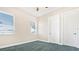 Bedroom with carpeted floors, windows with blinds and two doors at 5400 Emerald Bay Ln, Lady Lake, FL 32159