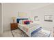 Bright bedroom with a queen-size bed, stylish decor, and ample natural light at 6113 Chorus Dr, Mascotte, FL 34753