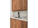 Stylish wet bar with wood cabinets and a sleek sink at 6113 Chorus Dr, Mascotte, FL 34753