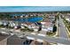 Community view with lake, fountain, and many houses with solar panels at 7613 Wandering Way, Orlando, FL 32836