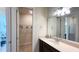 Clean bathroom with a vanity, large mirror, and access to a walk-in closet at 7613 Wandering Way, Orlando, FL 32836