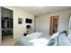 Cozy bedroom with a queen bed and an attached bathroom at 7613 Wandering Way, Orlando, FL 32836
