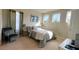 Cozy bedroom with a single bed, natural light, and a comfortable sitting area at 7613 Wandering Way, Orlando, FL 32836