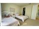 Two twin beds in a bright and cheery bedroom with ample closet space at 7613 Wandering Way, Orlando, FL 32836