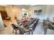 Large dining room with a glass top table and seating for 10 at 7613 Wandering Way, Orlando, FL 32836