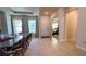 Bright entryway with tile floors, leading to dining room and home gym at 7613 Wandering Way, Orlando, FL 32836