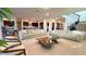 Spacious living room with light beige sectional sofa and modern coffee table at 7613 Wandering Way, Orlando, FL 32836