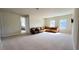 Large loft area with leather seating and views to a bedroom at 7613 Wandering Way, Orlando, FL 32836