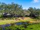 Community view with lakefront and lush trees at 7616 Spring Bay Cv # S, Orlando, FL 32819