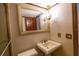 Clean bathroom with pedestal sink and large mirror at 7616 Spring Bay Cv # S, Orlando, FL 32819
