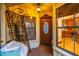 Enclosed porch with stained glass door and view of kitchen at 7616 Spring Bay Cv # S, Orlando, FL 32819