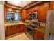 Modern kitchen with granite counters and stainless steel appliances at 7616 Spring Bay Cv # S, Orlando, FL 32819