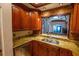 Modern kitchen with granite countertops and wood cabinets at 7616 Spring Bay Cv # S, Orlando, FL 32819