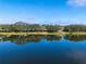 Expansive lakefront view with homes and lush greenery at 7616 Spring Bay Cv # S, Orlando, FL 32819