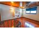Loft bedroom with hardwood floors and built-in desk at 7616 Spring Bay Cv # S, Orlando, FL 32819