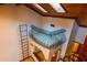 Unique loft bedroom with metal railing and ladder access at 7616 Spring Bay Cv # S, Orlando, FL 32819