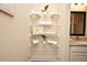Bathroom linen closet with stylish towel and decor display at 7958 Delwin Ln, Kissimmee, FL 34747