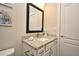Bathroom with a granite countertop and coastal decor at 7958 Delwin Ln, Kissimmee, FL 34747