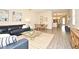 Spacious living room boasts stylish furnishings and an open floor plan connecting to the kitchen at 7958 Delwin Ln, Kissimmee, FL 34747