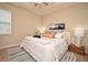 Serene main bedroom featuring plush bedding, soft lighting, and stylish decor for a cozy retreat at 7958 Delwin Ln, Kissimmee, FL 34747