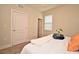 Inviting main bedroom with a well-made bed, natural light, and closet access at 7958 Delwin Ln, Kissimmee, FL 34747