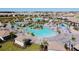 Aerial view of a large community pool and surrounding amenities at 8828 Cruden Bay Ct, Davenport, FL 33896