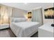 King-size bed, TV, and modern decor at 8828 Cruden Bay Ct, Davenport, FL 33896