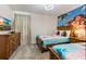 Themed bedroom with two twin beds and Moana wall art at 8828 Cruden Bay Ct, Davenport, FL 33896