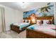 Charming bedroom with two twin beds and Moana-themed decor at 8828 Cruden Bay Ct, Davenport, FL 33896