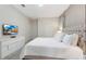 King-size bed and a modern dresser at 8828 Cruden Bay Ct, Davenport, FL 33896