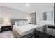 Comfortable main bedroom with king-size bed and modern nightstands at 8828 Cruden Bay Ct, Davenport, FL 33896