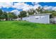 Spacious backyard with grassy area and detached building at 901 S Solandra Dr, Orlando, FL 32807